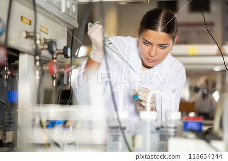 Portrait of young woman lab technician working Portrait of young woman lab technician working 118634344