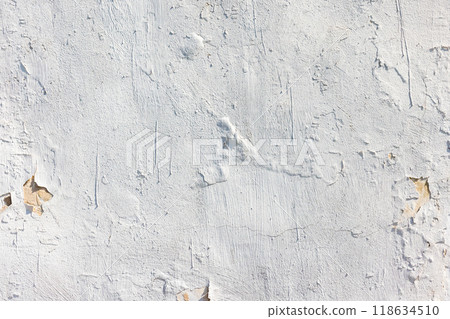 Old concrete wall with white peeling paint, background texture 118634510