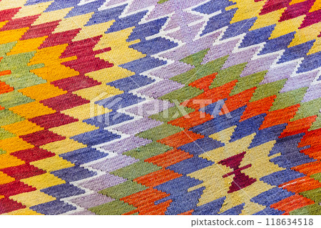 Oriental colorful woolen carpet with traditional ethnic geometric ornament 118634518