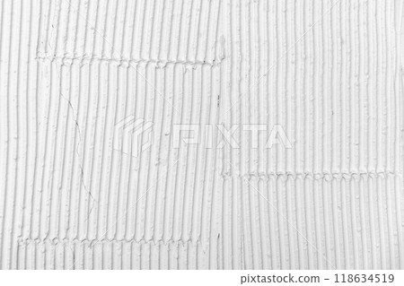 White wall with decorative stucco relief pattern. Front view, background texture White wall with decorative stucco relief pattern. Front view, background texture 118634519
