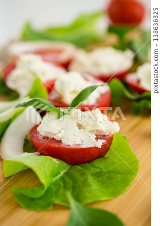 tomato wedges with cottage cheese filling and garlic, spicy appetizer tomato wedges with cottage cheese filling and garlic, spicy appetizer 118636325