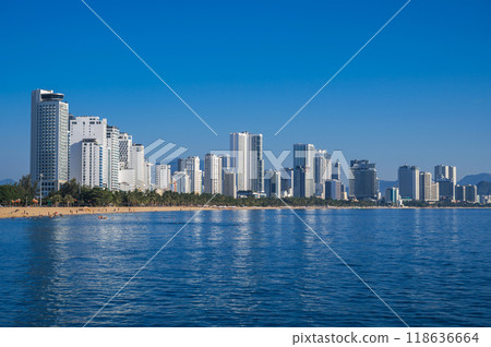 Panorama of the resort of Nha Trang city in Vietnam with a sandy beach by sea and skyscrapers of hotels in summer 118636664