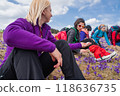 Group of female hikers in mountains during saffron blooming at spring 118636735