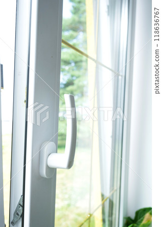 Window from inside the house plastic double-glazed window view outside to the sunny forest - interior salon with potted plants, clean glass after cleaning windows, closed window Window from inside the house plastic double-glazed window view outside to the sunny forest - interior salon with potted plants, clean glass after cleaning windows, closed window 118636767