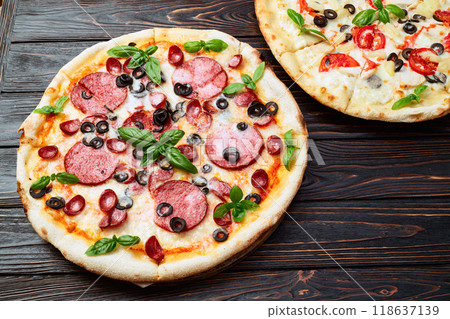 2 pizza with mozzarella cheese , salami sausages , olives , chicken , pineapple and tomatoes 2 pizza with mozzarella cheese , salami sausages , olives , chicken , pineapple and tomatoes 118637139