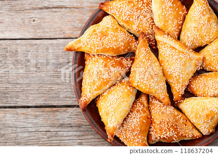 Homemade triangle puff pastry with meat on rustic background . Samosa 118637204