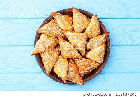 Homemade triangle puff pastry with meat on rustic background . Samosa Homemade triangle puff pastry with meat on rustic background . Samosa 118637205