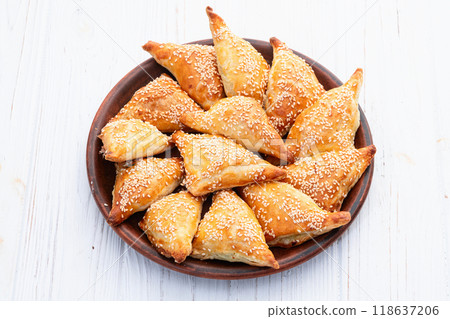 Homemade triangle puff pastry with meat on rustic background . Samosa 118637206