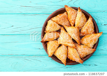 Homemade triangle puff pastry with meat on rustic background . Samosa 118637207