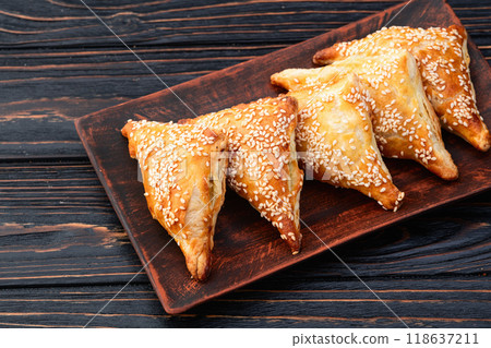 Homemade triangle puff pastry with meat on rustic background . Samosa 118637211