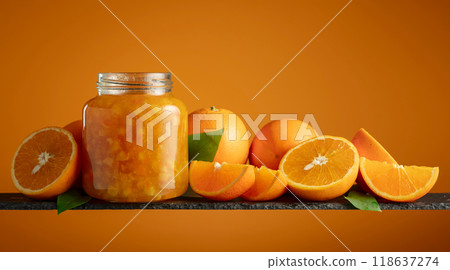 Orange jam in glass jar and fresh fruits. Orange jam in glass jar and fresh fruits. 118637274