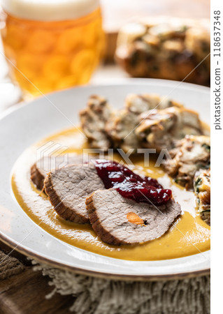 Beef fillets from sirloin steak with traditional Czech sauce, Karlovy Vary dumpling with cranberries and good Czech beer 118637348
