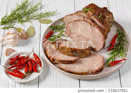 Roast Pork Neck sliced on a plate, top view 118637981