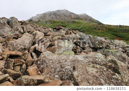 One of Japan's 100 famous mountains, Mt. Tomuratushi, hiking trail, first snow on the summit as seen from near Mae Tomudaira One of Japan's 100 famous mountains, Mt. Tomuratushi, hiking trail, first snow on the summit as seen from near Mae Tomudaira 118638151