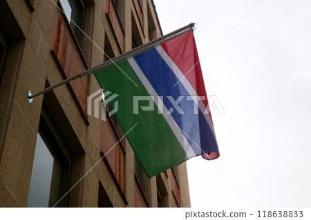 Flag of Gambia waving atop of its pole Flag of Gambia waving atop of its pole 118638833