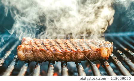 Delicious juicy beef steak grilling on barbecue grill 118639030