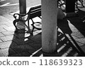 A park bench with a shadow 118639323