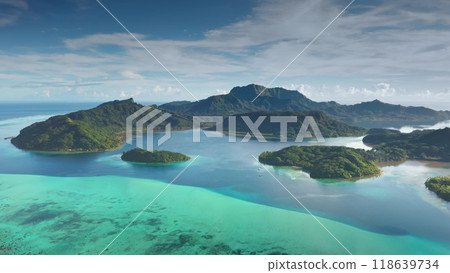 Aerial view tropical landscape green islands archipelago coral barrier reef turquoise water lagoon. Breathtaking beauty of French Polynesia. Stunning travel paradise, perfect exotic summer vacation Aerial view tropical landscape green islands archipelago coral barrier reef turquoise water lagoon. Breathtaking beauty of French Polynesia. Stunning travel paradise, perfect exotic summer vacation 118639734