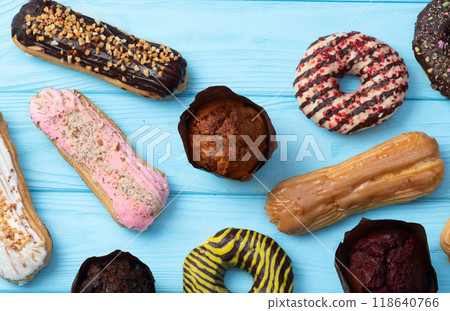 Mix of muffins ( cupcake ) chocolate , vanilla , berries . Top view 118640766