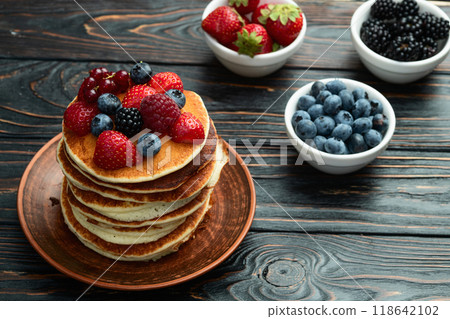 Stack of homemade american pancakes with berries . Top view Stack of homemade american pancakes with berries . Top view 118642102