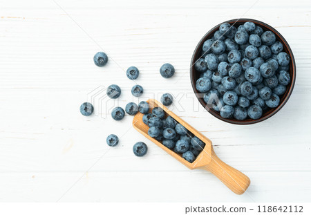Blueberry photography in a bowl on rustic background 118642112