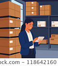 Female manager at a post office. In the background is a warehouse of parcels with products ready for shipment. 118642160
