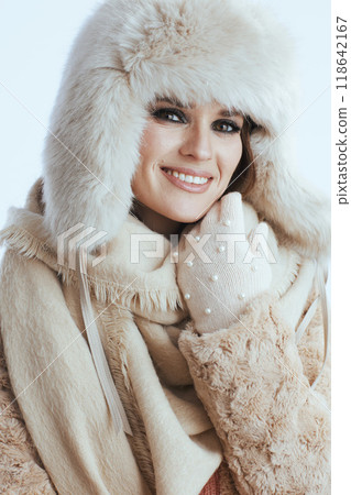 smiling stylish 40 year old woman touching face on white 118642167