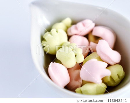 Colorful gummy bears in the shape of animal paw prints Colorful gummy bears in the shape of animal paw prints 118642241