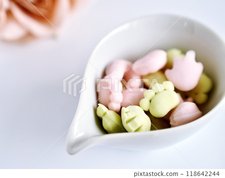 Colorful gummy bears in the shape of animal paw prints Colorful gummy bears in the shape of animal paw prints 118642244