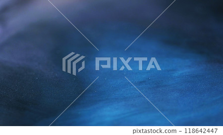 Sparkling texture. Glitter particles. Defocused blue pigment flow wave deep sea color mix decorative abstract art background. 118642447