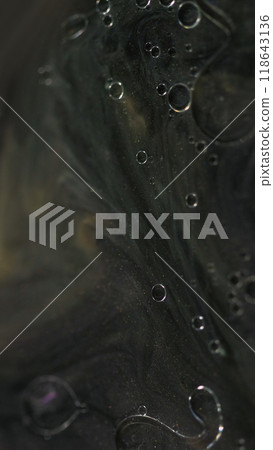 Oil drops paint. Shimmer ink. Defocused black golden color floating translucent bubbles shiny particles glitter glowing emulsion flow motion abstract art background. Oil drops paint. Shimmer ink. Defocused black golden color floating translucent bubbles shiny particles glitter glowing emulsion flow motion abstract art background. 118643136