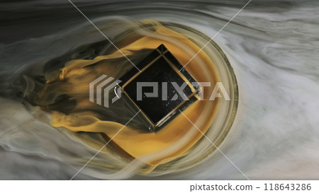 Smoke flow. Ink water. White yellow black color mixing mist wave flood around dark glowing galaxy square shape round glass abstract background. 118643286
