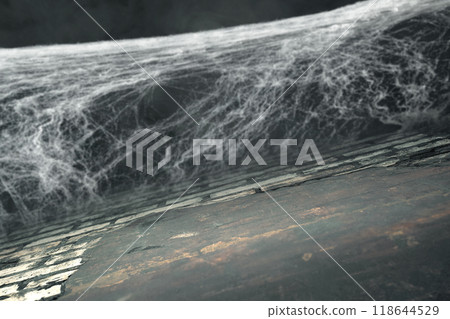 Spooky creepy cobweb spider web with grunge wall in the dark room. The scene is somewhat eerie and mysterious Spooky creepy cobweb spider web with grunge wall in the dark room. The scene is somewhat eerie and mysterious 118644529