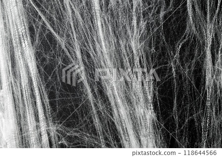 Spooky creepy cobweb spiders web covered a black background. Abstract halloween background. Spooky creepy cobweb spiders web covered a black background. Abstract halloween background. 118644566
