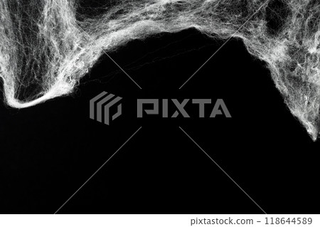 Spooky creepy cobweb spiders web covered a black background. Abstract halloween background. Spooky creepy cobweb spiders web covered a black background. Abstract halloween background. 118644589