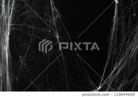 Spooky creepy cobweb spiders web covered a black background. Abstract halloween background. Spooky creepy cobweb spiders web covered a black background. Abstract halloween background. 118644689