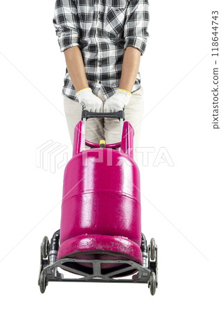 A man is carrying a pink gas cylinder on a cart 118644743