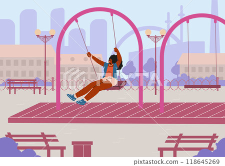 A joyful dark-skinned woman in a T-shirt and shorts swings on a swing in a city park. 118645269