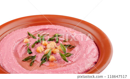 Beetroot hummus decorated with chickpeas and green onions in a clay dish Beetroot hummus decorated with chickpeas and green onions in a clay dish 118647517