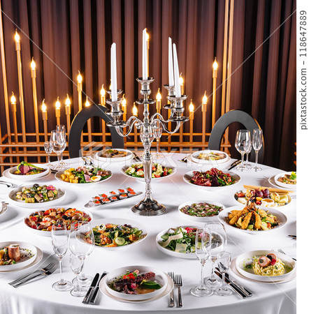 Elegant banquet table setting with gourmet cuisine Elegant banquet table setting with gourmet cuisine 118647889
