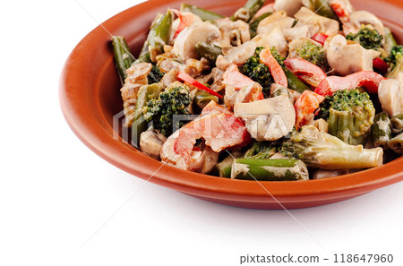 Sauteed mushrooms, broccoli, green beans, and peppers on a plate 118647960