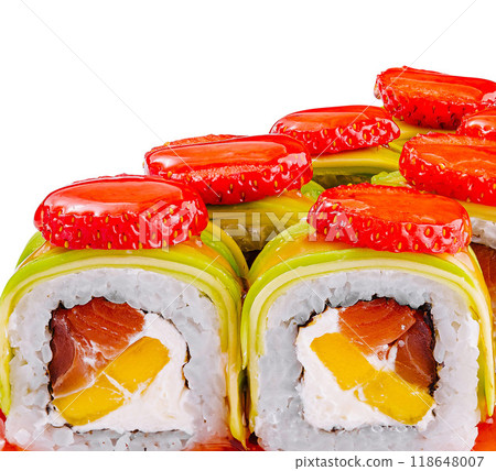 Delicious uramaki sushi rolls being decorated with strawberries and mango Delicious uramaki sushi rolls being decorated with strawberries and mango 118648007