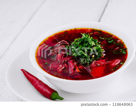 Traditional ukrainian russian borscht soup with beetroot in white bowl Traditional ukrainian russian borscht soup with beetroot in white bowl 118648063