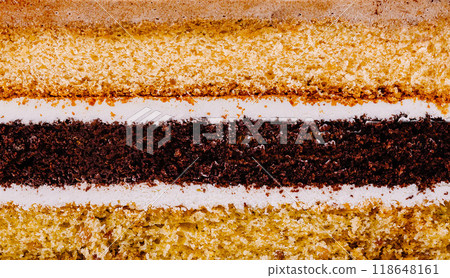 Delicious layered cake with white frosting showing its texture Delicious layered cake with white frosting showing its texture 118648161