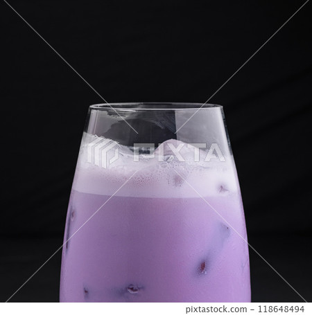 Purple taro bubble tea standing on dark background 118648494