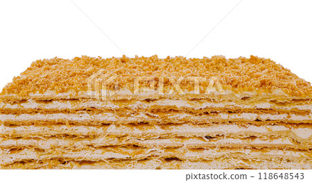 Delicious multi layered napoleon cake with crumb topping isolated on white background Delicious multi layered napoleon cake with crumb topping isolated on white background 118648543