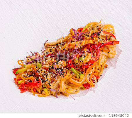 Udon noodles with chicken and vegetables sprinkled with sesame seeds Udon noodles with chicken and vegetables sprinkled with sesame seeds 118648642