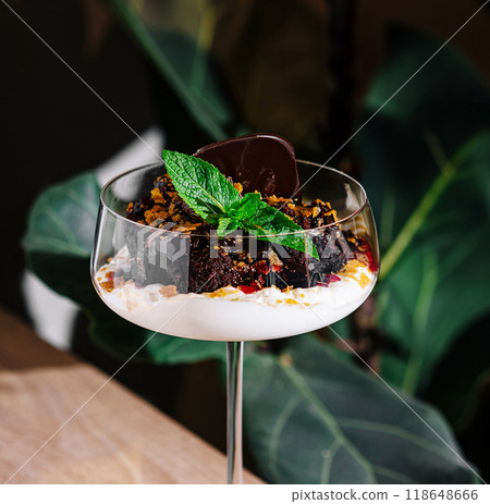 Chocolate dessert served in fancy glass on tabletop Chocolate dessert served in fancy glass on tabletop 118648666