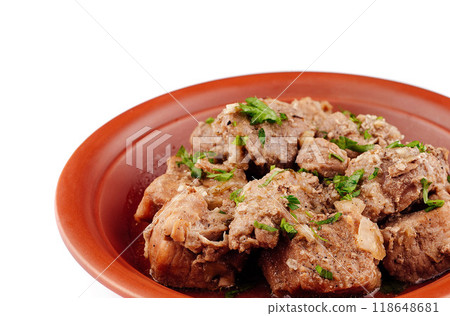 Stewed pork meat with herbs and spices on a plate 118648681