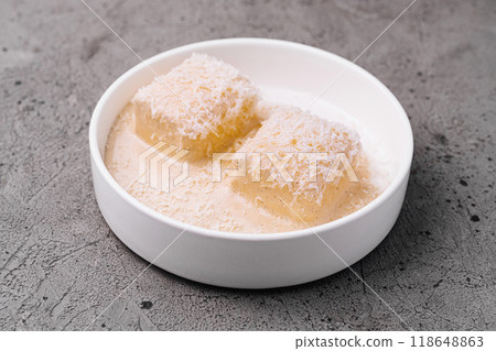 Two slices of delicious lasagna resting in a white bowl Two slices of delicious lasagna resting in a white bowl 118648863